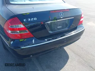 2003 Mercedes-Benz E-Class 3.2L with VIN WDBUF65J33A112308, listed as a IAAI auction lot 41871334 with 138,522 mi miles. Bid and sale history available at carsss.com. Image 6.