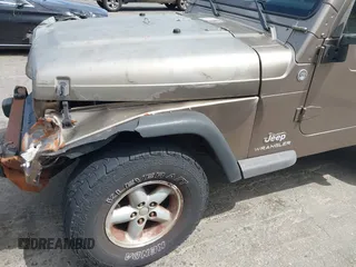 2005 Jeep Wrangler Sport with VIN 1J4FA49SX5P317120, listed as a IAAI auction lot 42677397 with 71,403 mi miles and . Bid and sale history available at DreamBid. Image 17.