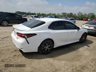 2023 Toyota Camry SE with VIN 4T1G11AKXPU767953, listed as a Copart auction lot 50728415 with 63,249 mi miles and Salvage Title. Bid and sale history available at DreamBid. Image 3.