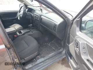 2004 Jeep Grand Cherokee Laredo z VIN 1J4GW48S34C399804, wystawiony jako IAAI lot #42163326 z przebiegiem 203 278 mil mil oraz . Historia ofert i sprzedaży dostępna na DreamBid. Obrazek 5.