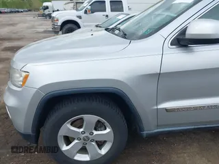 2011 Jeep Grand Cherokee Laredo with VIN 1J4RR4GG0BC622732, listed as a IAAI auction lot 42218785 with 127,186 mi miles and . Bid and sale history available at DreamBid. Image 6.