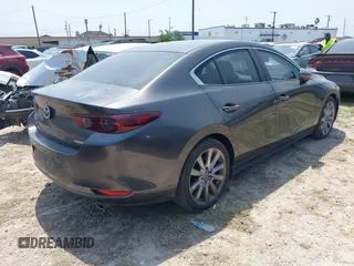 2021 Mazda 3 Preferred with VIN JM1BPACL1M1317639, listed as a IAAI auction lot 41939340 with 51,195 mi miles and . Bid and sale history available at DreamBid. Image 4.