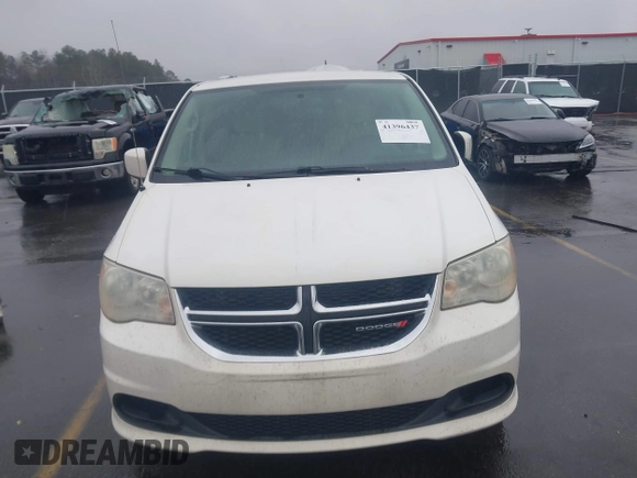 2012 Dodge Grand Caravan SXT with VIN 2C4RDGCG4CR304472, listed as a IAAI auction lot 41396437 with 180,309 mi miles and . Bid and sale history available at DreamBid. Image 12.