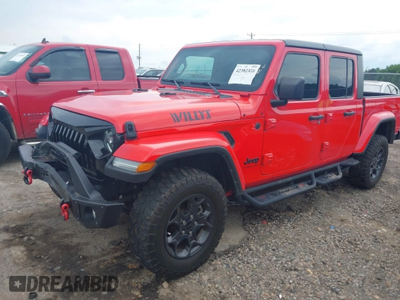 2023 Jeep Gladiator Sport S z VIN 1C6HJTAG4PL544871, wystawiony jako IAAI lot #42382428 z przebiegiem 33 453 mil mil oraz . Historia ofert i sprzedaży dostępna na DreamBid. Obrazek 2.