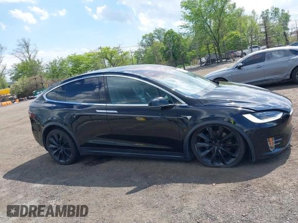 2019 Tesla Model X 75D with VIN 5YJXCBE21KF180203, listed as a IAAI auction lot 42190255 with 114,294 mi miles and . Bid and sale history available at DreamBid. Image 13.