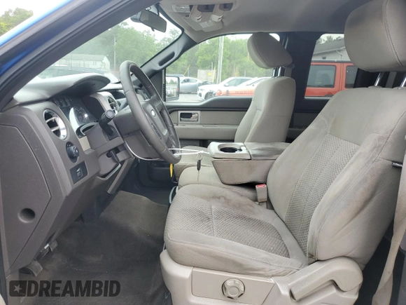 2009 Ford F-150 STX with VIN 1FTRX128X9FB21799, listed as a Copart auction lot 58263855 with 214,192 mi miles and Salvage title. Bid and sale history available at DreamBid. Image 7.