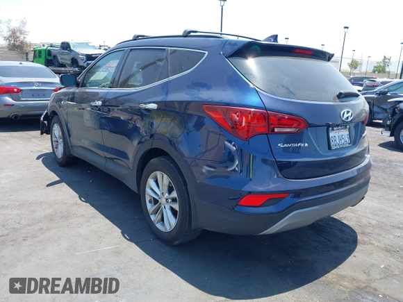 2018 Hyundai Santa Fe 2.0T z VIN 5XYZU4LA8JG537427, wystawiony jako IAAI lot #42349692 z przebiegiem 148 764 mil mil oraz . Historia ofert i sprzedaży dostępna na DreamBid. Obrazek 3.