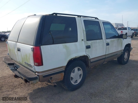 1997 Chevrolet Tahoe with VIN 1GNEK13R3VJ416827, listed as a IAAI auction lot 42041780 with 143,566 mi miles. Bid and sale history available at carsss.com. Image 4.