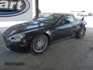 2009 Aston Martin Vantage z VIN SCFBF04CX9GD11858, wystawiony jako Copart lot #53907885 z przebiegiem 87 495 mil mil oraz Szkody całkowita. Historia ofert i sprzedaży dostępna na DreamBid. Obrazek 1.