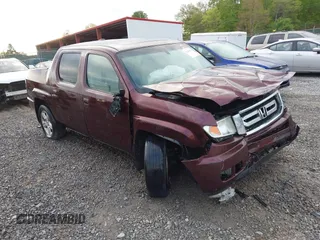 2010 Honda Ridgeline RTL with VIN 5FPYK1F57AB005602, listed as a IAAI auction lot 42208633 with 106,777 mi miles and . Bid and sale history available at DreamBid. Image 1.