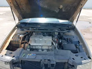 1999 Cadillac DeVille z VIN 1G6KD54Y2XU788781, wystawiony jako IAAI lot #42390531 z przebiegiem 180 328 mil mil oraz . Historia ofert i sprzedaży dostępna na DreamBid. Obrazek 10.