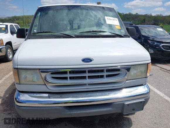 1999 Ford Econoline Cargo Recreational with VIN 1FDRE14L2XHA41059, listed as a IAAI auction lot 42067879 with 149,185 mi miles. Bid and sale history available at carsss.com. Image 12.