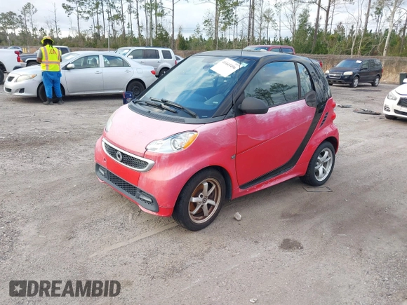 2015 Smart fortwo Passion z VIN WMEEJ3BA0FK815839, wystawiony jako IAAI lot #41443496 z przebiegiem 75 574 mil mil oraz . Historia ofert i sprzedaży dostępna na DreamBid. Obrazek 2.