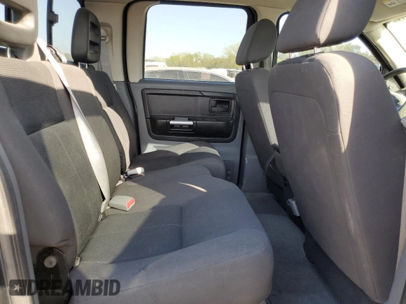 2006 Mitsubishi Raider z VIN 1Z7HT38K76S574856, wystawiony jako Copart lot #74367324 z przebiegiem 176 611 mil mil oraz Czysty tytuł • Clean title. Historia ofert i sprzedaży dostępna na DreamBid. Obrazek 10.