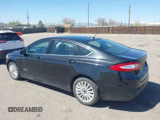 2013 Ford Fusion SE Hybrid with VIN 3FA6P0LUXDR298606, listed as a IAAI auction lot 41976525 with 121,660 mi miles. Bid and sale history available at carsss.com. Image 3.