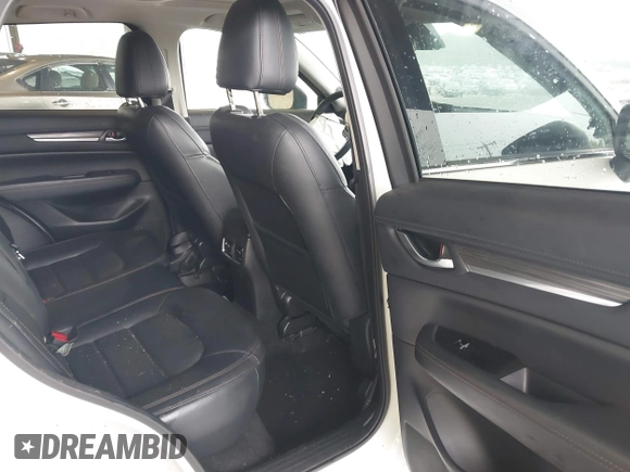 2019 Mazda CX-5 Grand Touring with VIN JM3KFBDMXK0648813, listed as a IAAI auction lot 42524680 with 23,521 mi miles and . Bid and sale history available at DreamBid. Image 8.