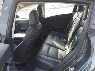 2018 Tesla Model 3 Long Range Battery with VIN 5YJ3E1EB5JF063077, listed as a IAAI auction lot 41773551 with 99,477 mi miles and . Bid and sale history available at DreamBid. Image 8.