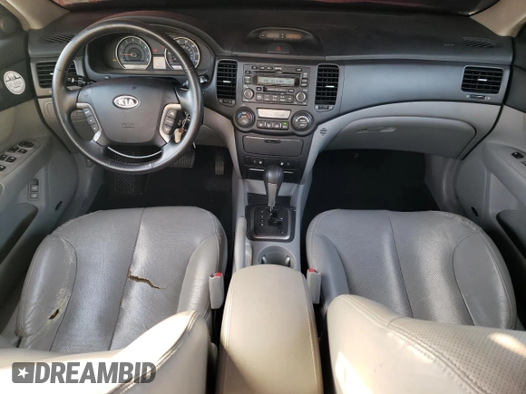 2007 Kia Optima EX with VIN KNAGE124875154603, listed as a Copart auction lot 79768494 with 76,588 mi miles and Salvage Title. Bid and sale history available at carsss.com. Image 8.