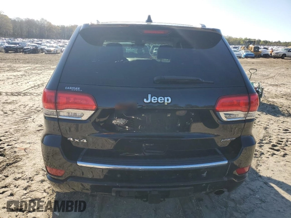 2017 Jeep Grand Cherokee Overland with VIN 1C4RJFCT3HC755960, listed as a Copart auction lot 52268895 with 99,998 mi miles and Salvage title. Bid and sale history available at DreamBid. Image 6.
