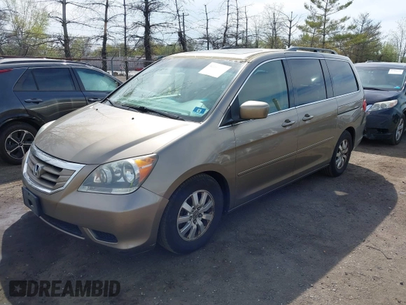 2010 Honda Odyssey EX-L with VIN 5FNRL3H68AB055744, listed as a IAAI auction lot 42107273 with 193,289 mi miles. Bid and sale history available at carsss.com. Image 2.