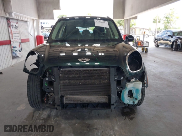 2013 MINI Countryman S with VIN WMWZC3C56DWP24170, listed as a IAAI auction lot 42366594 with 143,311 mi miles and . Bid and sale history available at DreamBid. Image 13.