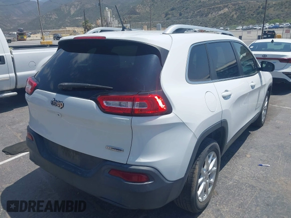 2015 Jeep Cherokee Latitude with VIN 1C4PJLCB7FW790865, listed as a IAAI auction lot 42182034 with 161,642 mi miles and . Bid and sale history available at carsss.com. Image 4.