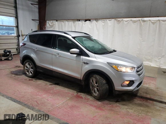 2018 Ford Escape SE with VIN 1FMCU9GD7JUA25403, listed as a Copart auction lot 87158814 with 121,281 mi miles and Salvage Title. Bid and sale history available at carsss.com. Image 4.