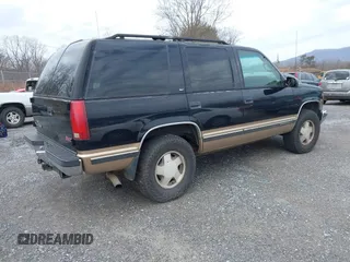 1999 GMC Yukon with VIN 1GKEK13R9XJ807786, listed as a IAAI auction lot 41478109 with 193,748 mi miles. Bid and sale history available at carsss.com. Image 4.