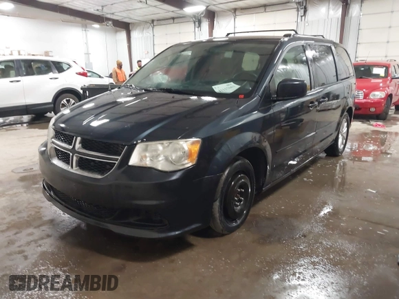 2014 Dodge Grand Caravan SXT with VIN 2C4RDGCGXER154709, listed as a IAAI auction lot 41117603 with 214,872 mi miles and . Bid and sale history available at DreamBid. Image 17.