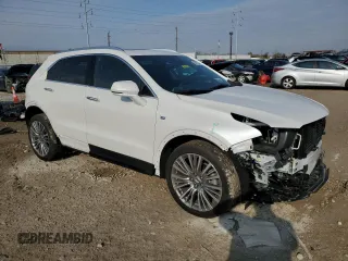 2024 Cadillac XT4 AWD Premium Luxury with VIN 1GYFZDR40RF225603, listed as a Copart auction lot 87899975 with 1,659 mi miles and Salvage title. Bid and sale history available at DreamBid. Image 4.