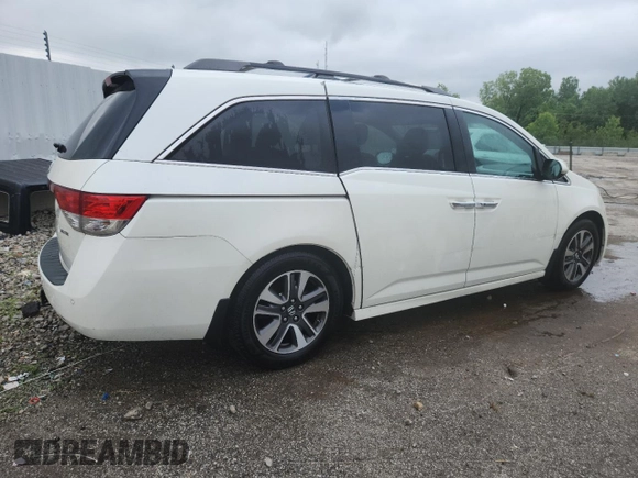 2014 Honda Odyssey Touring with VIN 5FNRL5H95EB083772, listed as a Copart auction lot 56713525 with 215,833 mi miles and Salvage title. Bid and sale history available at DreamBid. Image 3.