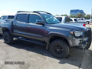 2021 Toyota Tacoma SR with VIN 3TMCZ5AN4MM449310, listed as a IAAI auction lot 42527596 with 23,211 mi miles and . Bid and sale history available at DreamBid. Image 1.