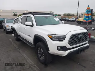 2023 Toyota Tacoma SR5 z VIN 3TMDZ5BN7PM162132, wystawiony jako IAAI lot #41880192 z przebiegiem 22 368 mil mil oraz . Historia ofert i sprzedaży dostępna na DreamBid. Obrazek 1.