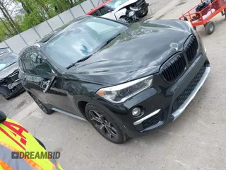 2016 BMW X1 xDrive28i z VIN WBXHT3Z32G4A51890, wystawiony jako IAAI lot #42225136 z przebiegiem 125 698 mil mil oraz . Historia ofert i sprzedaży dostępna na DreamBid. Obrazek 1.