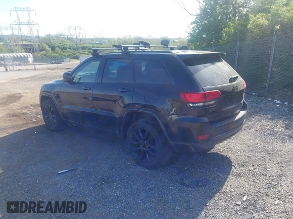 2018 Jeep Grand Cherokee Laredo E with VIN 1C4RJFAG2JC320441, listed as a IAAI auction lot 42095419 with 136,962 mi miles. Bid and sale history available at carsss.com. Image 3.