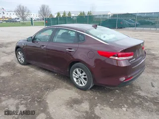 2016 Kia Optima LX with VIN 5XXGT4L36GG108599, listed as a IAAI auction lot 42065639 with 127,387 mi miles. Bid and sale history available at carsss.com. Image 3.