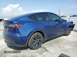 2024 Tesla Model Y with VIN 7SAYGDED0RF102479, listed as a Copart auction lot 55431975 with 23,989 mi miles and Salvage title. Bid and sale history available at DreamBid. Image 3.