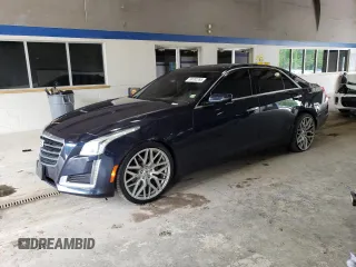 2015 Cadillac CTS Luxury AWD with VIN 1G6AX5SX6F0125216, listed as a Copart auction lot 58782265 with 103,798 mi miles and Salvage title. Bid and sale history available at DreamBid. Image 1.