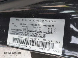 2012 Mazda Mazda3 i Touring with VIN JM1BL1L77C1559753, listed as a IAAI auction lot 42037094 with 145,659 mi miles. Bid and sale history available at carsss.com. Image 9.