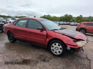 2001 Ford Taurus LX with VIN 1FAFP52UX1A176008, listed as a Copart auction lot 58983935 with 123,985 mi miles and Salvage title. Bid and sale history available at DreamBid. Image 4.