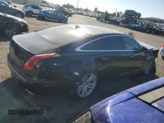 2014 Jaguar XJ with VIN SAJWA2GZXE8V59542, listed as a Copart auction lot 73672614 with 105,328 mi miles and Salvage Title. Bid and sale history available at carsss.com. Image 3.