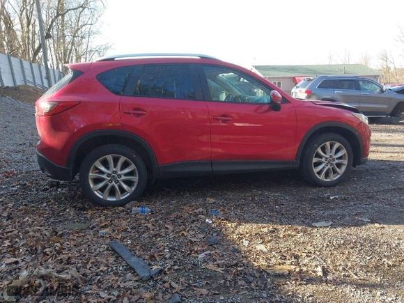 2014 Mazda CX-5 Grand Touring with VIN JM3KE2DY1E0380423, listed as a IAAI auction lot 41854206 with 129,763 mi miles. Bid and sale history available at carsss.com. Image 14.