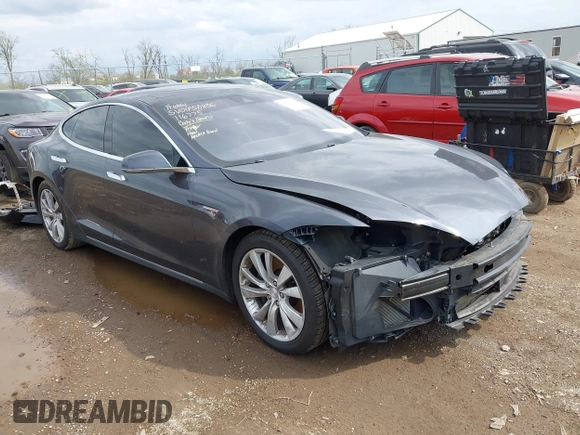 2015 Tesla Model S 85D with VIN 5YJSA1E21FF116775, listed as a IAAI auction lot 41876772 with 128,805 mi miles. Bid and sale history available at carsss.com. Image 1.