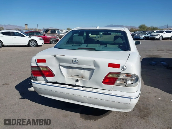 2002 Mercedes-Benz E-Class with VIN WDBJF82J62X076581, listed as a IAAI auction lot 41194976 with 235,453 mi miles. Bid and sale history available at carsss.com. Image 16.