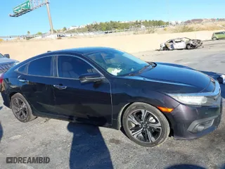 2016 Honda Civic Sedan Touring with VIN 19XFC1F99GE206092, listed as a IAAI auction lot 41031121 with 133,682 mi miles. Bid and sale history available at carsss.com. Image 13.
