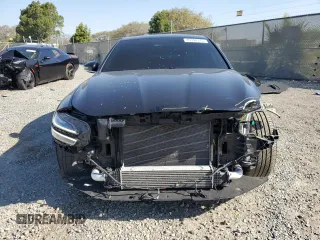 2022 Genesis G70 2.0T with VIN KMTG34TAXNU093905, listed as a Copart auction lot 45394115 with 57,495 mi miles and Salvage Title. Bid and sale history available at carsss.com. Image 5.