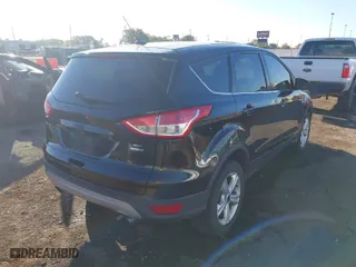 2015 Ford Escape SE with VIN 1FMCU9G91FUB50352, listed as a IAAI auction lot 40639198 with 126,862 mi miles. Bid and sale history available at carsss.com. Image 4.