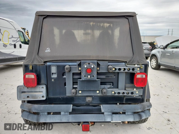 2000 Jeep Wrangler Sahara with VIN 1J4FA59S1YP777549, listed as a Copart auction lot 63622335 with 197,426 mi miles and Clean title. Bid and sale history available at DreamBid. Image 6.