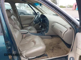 1998 Pontiac Bonneville SE with VIN 1G2HX52K0W4211117, listed as a IAAI auction lot 42125471 with 187,249 mi miles. Bid and sale history available at carsss.com. Image 5.
