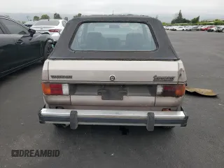 1984 Volkswagen Rabbit z VIN WVWCA0152EK015292, wystawiony jako Copart lot #55503315 z przebiegiem 216 970 mil mil oraz Tytuł czysty. Historia ofert i sprzedaży dostępna na DreamBid. Obrazek 6.